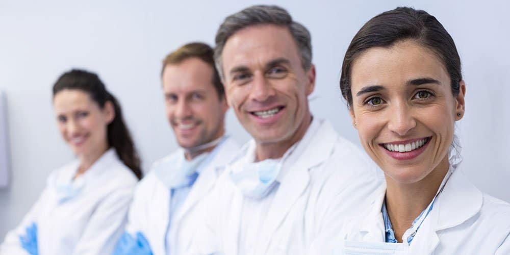 Line of smiling doctors